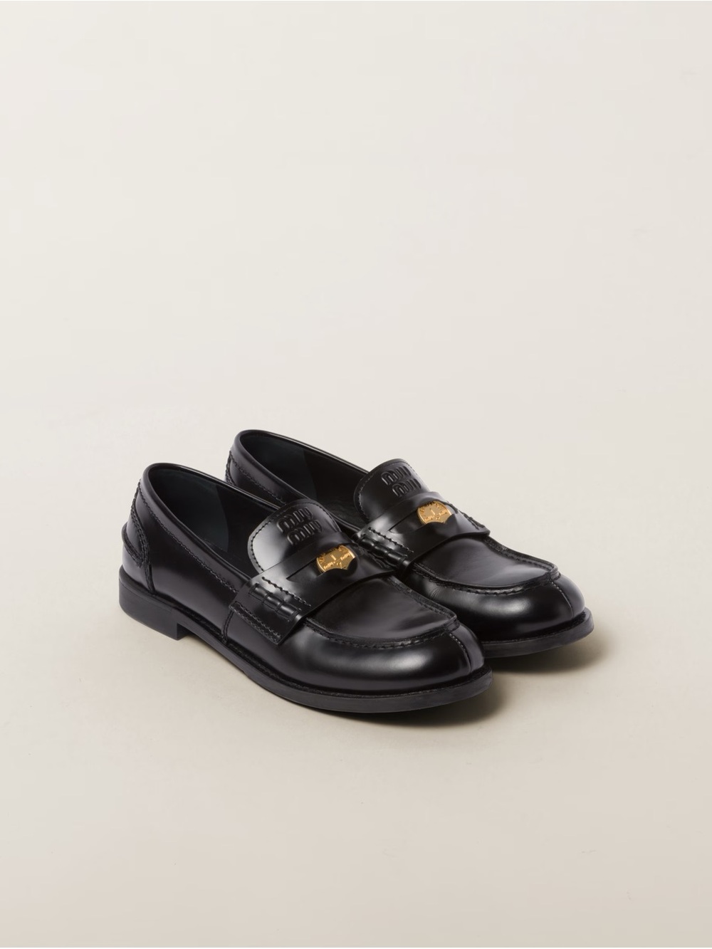 Miu Miu Black Leather Penny Loafers with Gold-Tone Accent